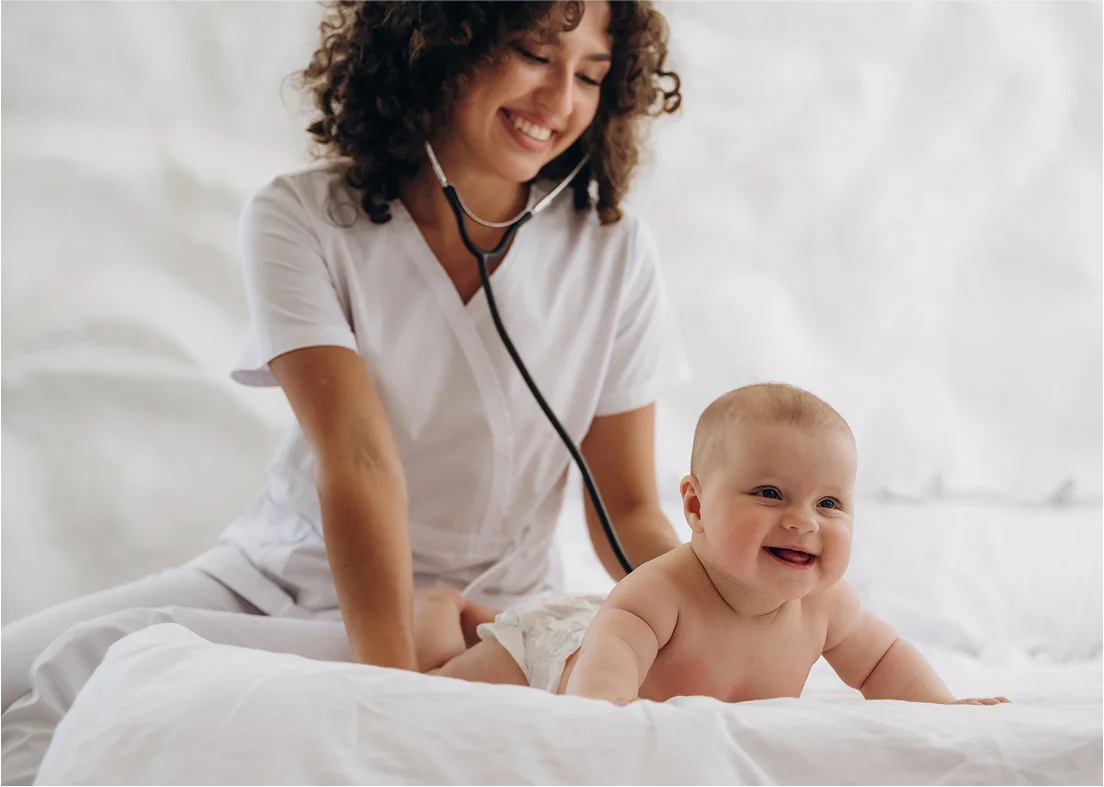 Mom holding baby in arms at home